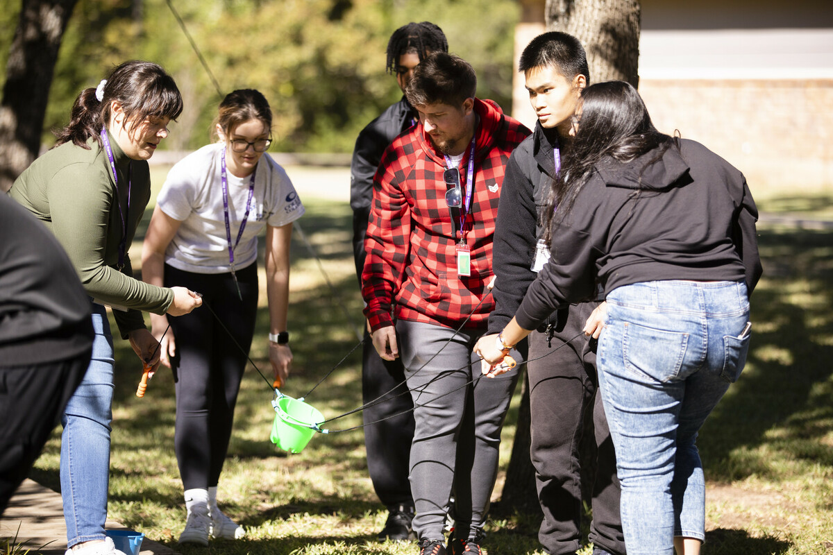 students with bucket at leadership camp