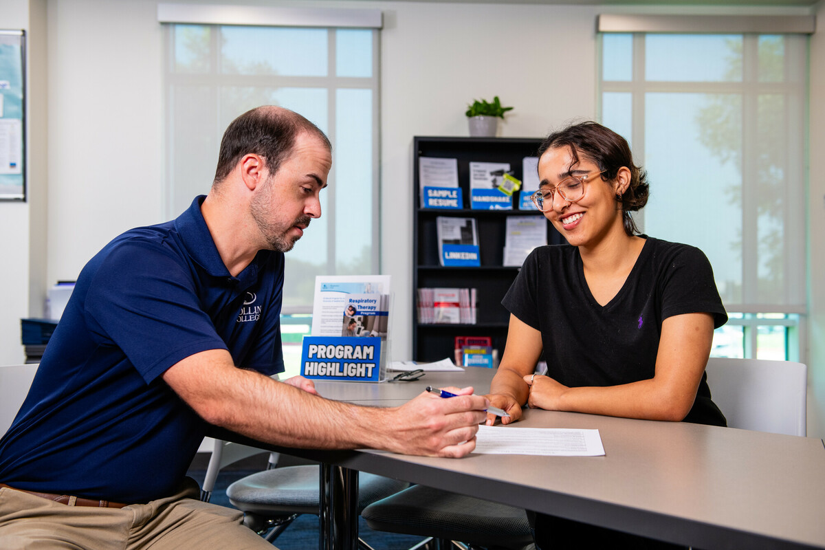 Student speaking with a career center staff member