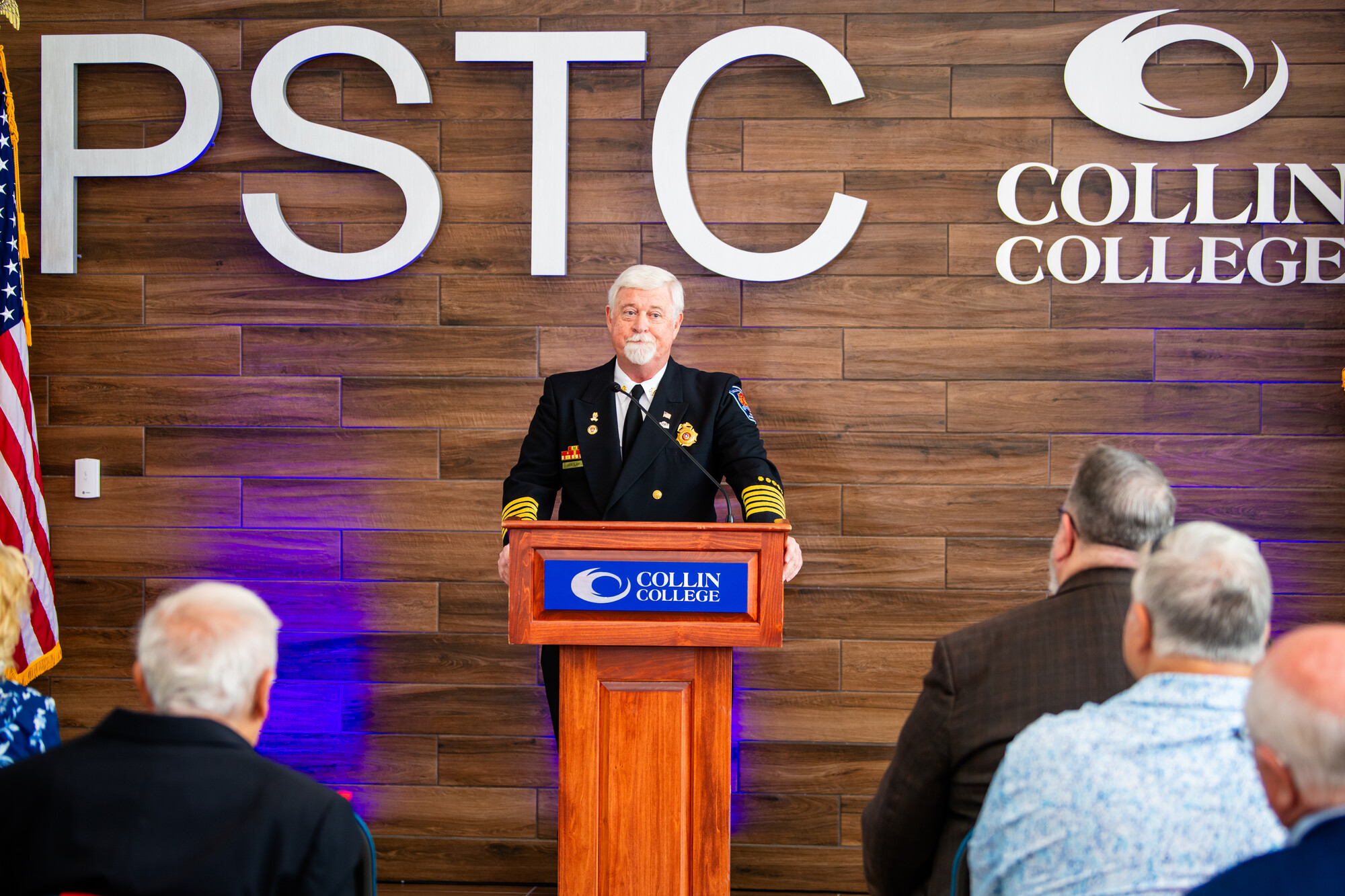 Man stands at podium. 