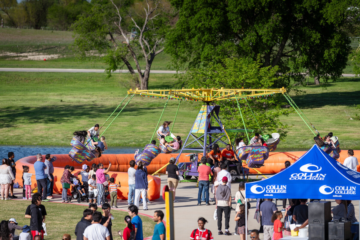 carnival ride and attendees 