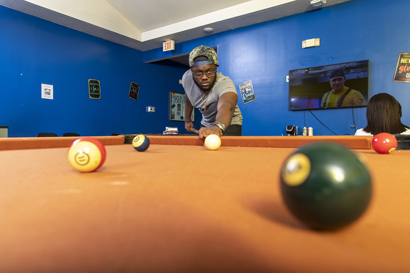 Resident playing pool